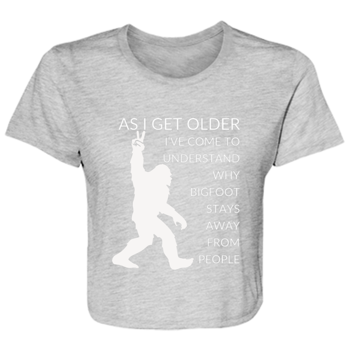 Athletic heather women's flowy cropped tee featuring Bigfoot silhouette and humorous quote 'As I get older, I've come to understand why bigfoot stays away from people' - stylish casual shirt for women