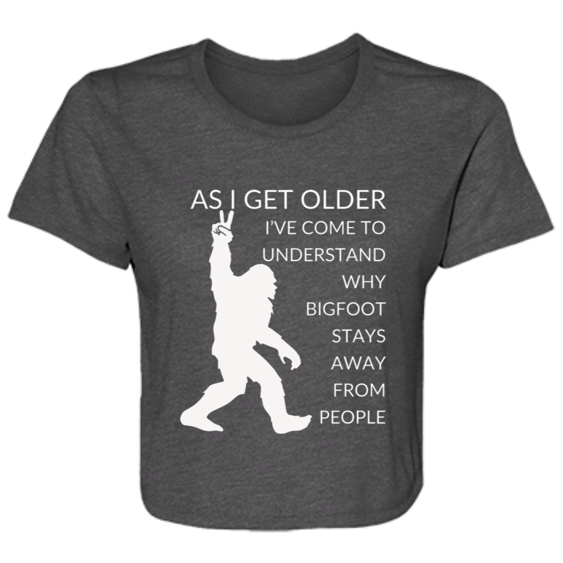 Dark grey heather women's flowy cropped tee featuring Bigfoot silhouette and humorous quote 'As I get older, I've come to understand why bigfoot stays away from people' - stylish casual shirt for women