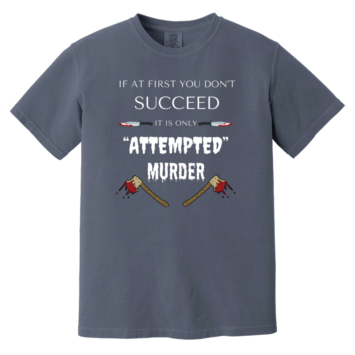 denim heavyweight garment-dyed cotton t-shirt featuring humorous quote 'If at first you don't succeed, it is only attempted murder' with images of bloody knives and axes