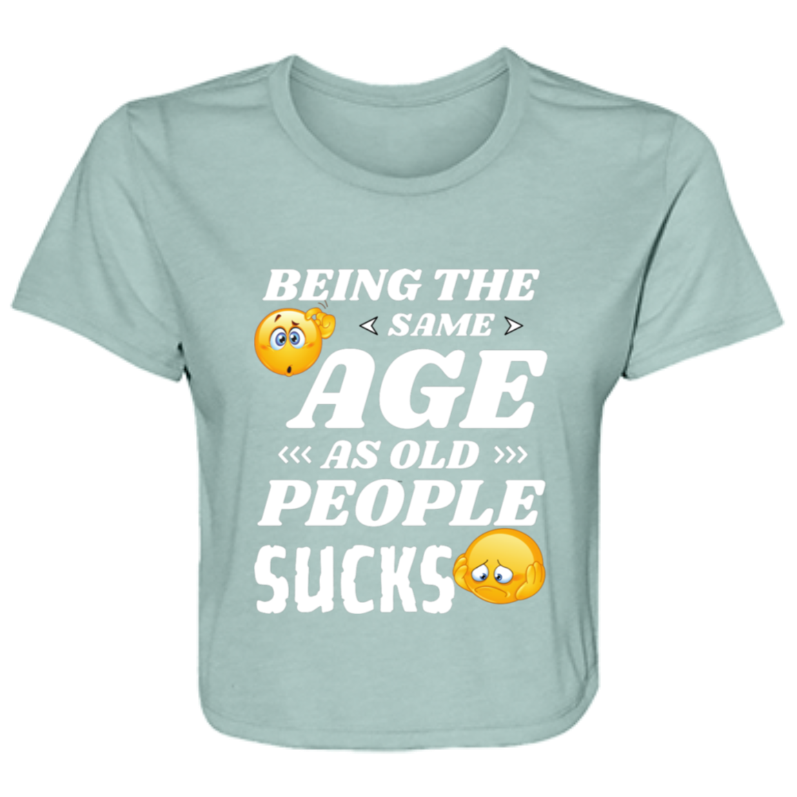 dusty blue women's flowy cropped tee with the humorous quote "Being the same age as old people sucks" and colorful emoji graphics.