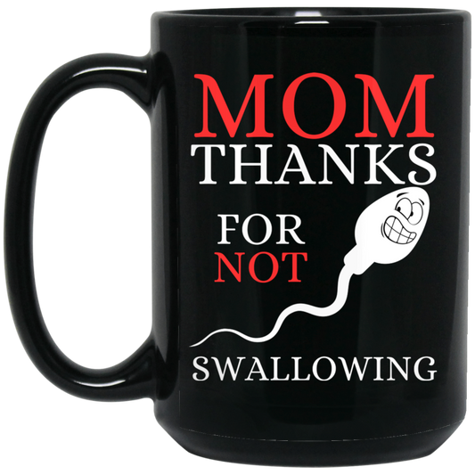High-quality 15oz black ceramic mug featuring a smiling sperm graphic and the message "MOM thanks for not swallowing,"