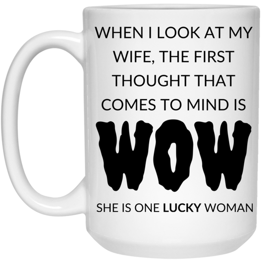 Humorous 15oz white ceramic mug for husbands featuring the message "When I look at my wife, the first thought that comes to mind is, WOW, she is one lucky woman,"