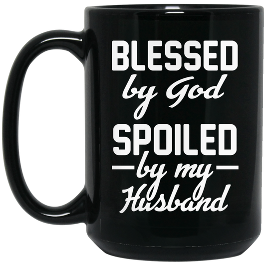 High-quality 15oz black ceramic mug with the humorous quote "Blessed by God, Spoiled by My Husband." great gift idea for wives
