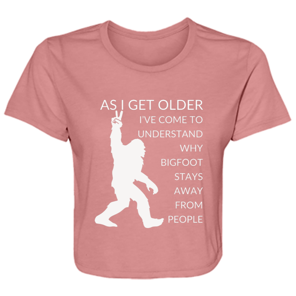 Mauve women's flowy cropped tee featuring Bigfoot silhouette and humorous quote 'As I get older, I've come to understand why bigfoot stays away from people' - stylish casual shirt for women